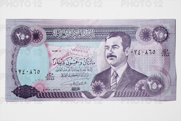 Iraq, Business, Finance, Money. An Iraqi bank note featuring portrait of former president Saddam Hussein.