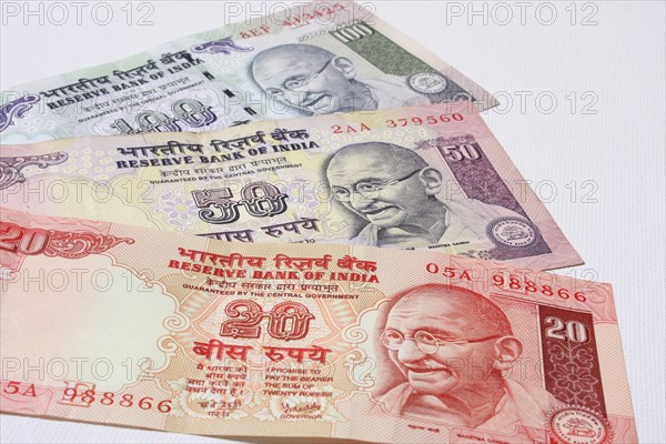 India, Business, Finance, Money  Indian bank notes of twenty  fifty and one hundred ruppee denominations  all featuring portrait of Mahatma Gandhi.