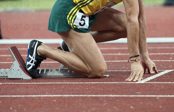 India, Delhi, 2010 Commonwealth games  Track event runner on his starting blocks.