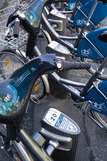 Ireland, County Dublin, Dublin City, Dublinbikes bicycle sharing scheme bikes parked and locked at stands at a station in the city centre.