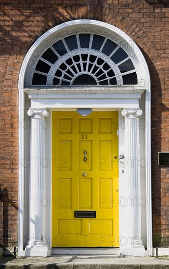 Ireland, County Dublin, Dublin City, Yellow Georgian door in the city centre south of the Liffey River.