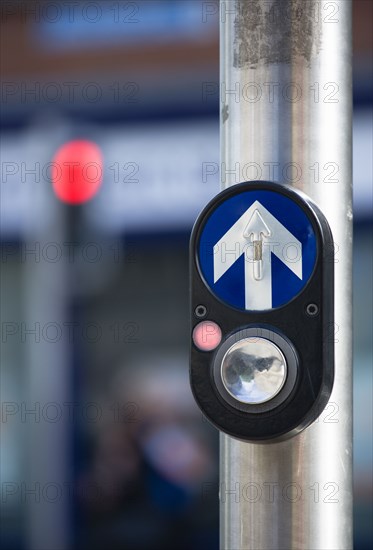 Ireland, County Dublin, Dublin City, Traffic light controlled pedestrian crossing button with halt red light displayed and direction arrow.
