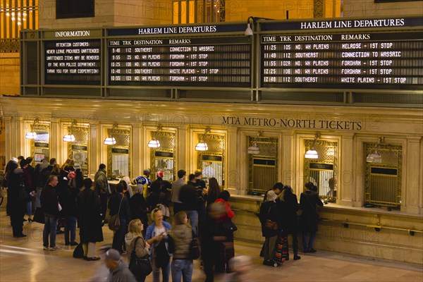 USA, New York, New York City, Manhattan  Grand Central Terminal railway station with people buying tickets from ticketing booths in the Main Concourse.