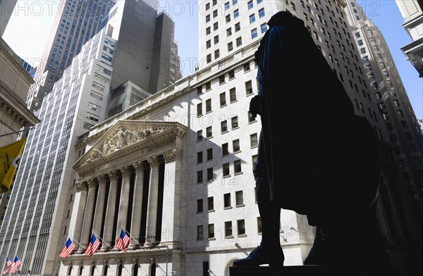 USA, New York, New York City, Manhattan  The New York Stock Exchange building in Broad Street beside Wall Street showing the main facade of the building featuring marble sculpture by John Quincy Adams Ward in the pediment called Integrity Protecting the W