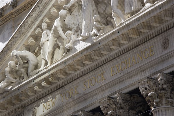 USA, New York, New York City, Manhattan  The New York Stock Exchange building in Broad Street beside Wall Street showing the main facade of the building featuring marble sculpture by John Quincy Adams Ward in the pediment called Integrity Protecting the W