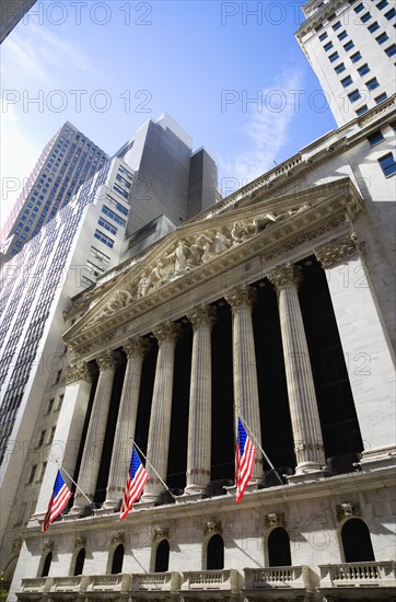 USA, New York, New York City, Manhattan  The New York Stock Exchange building in Broad Street beside Wall Street showing the main facade of the building featuring marble sculpture by John Quincy Adams Ward in the pediment called Integrity Protecting the W