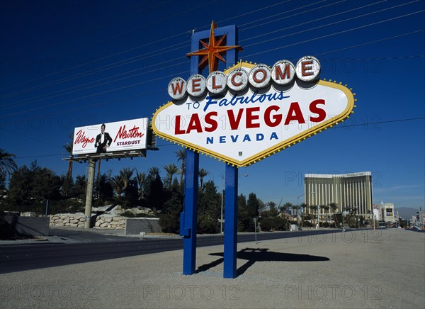 USA, Nevada, Las Vegas, The Strip  Las Vegas Boulevard south. Welcome to Fabulous Las Vegas sign  with Wayne Newton billboard and the Mandalay Hotel behind.