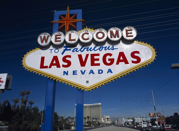 USA, Nevada, Las Vegas, Welcome to fabulous Las Vegas sign with the Mandalay hotel behind on Las Vegas Boulevard south.