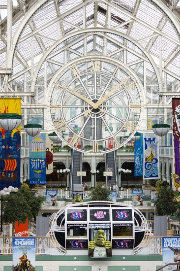 Ireland, County Dublin, Dublin City, The interior of Saint Stephens Green shopping mall with a large clock.