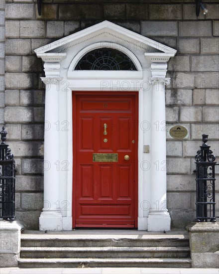 Ireland, County Dublin, Dublin City, Red Georgian door in the city centre south of the Liffey River.