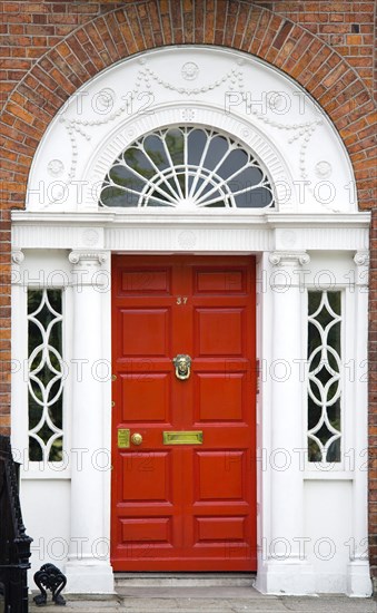 Ireland, County Dublin, Dublin City, Red Georgian door in the city centre south of the Liffey River.