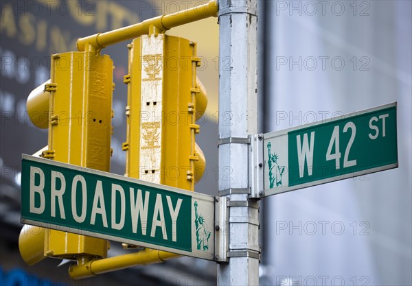 USA, New York, New York City, Manhattan  Roadsigns for Broadway at West 42nd Street in the theatre district with traffic lights.
