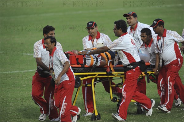 India, Delhi, 2010 Commonwealth games  Rugby game  injured player being taken off the pitch on wheeled stretcher.