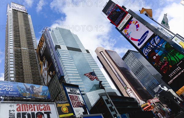 USA, New York, New York City, Manhattan  Times Square at the junction of 7th Avenue and Broadway below buildings with advertising on large video screens.