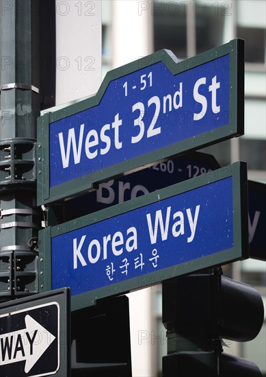 USA, New York, New York City, Manhattan  Street signs for West 32nd Street also known as Korea Way in Little Korea in Midtown.