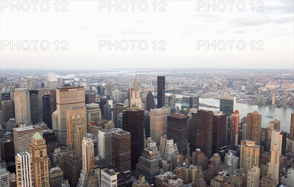 USA, New York, New York City, Manhattan  View from Empire State building over midtown skyscrapers and East River towards Queens and Long Island.