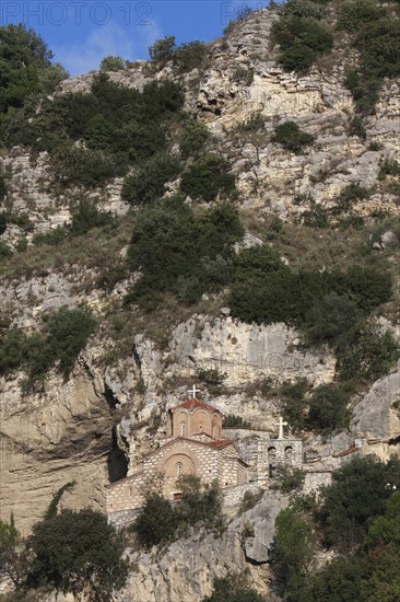 Albania, Berat, Church of St Michael under rock face.