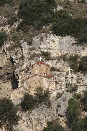 Albania, Berat, Church of St Michael under rock face.