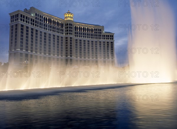 USA, Nevada, Las Vegas, Bellagio hotel and casino on the strip with fountain display in the foreground.