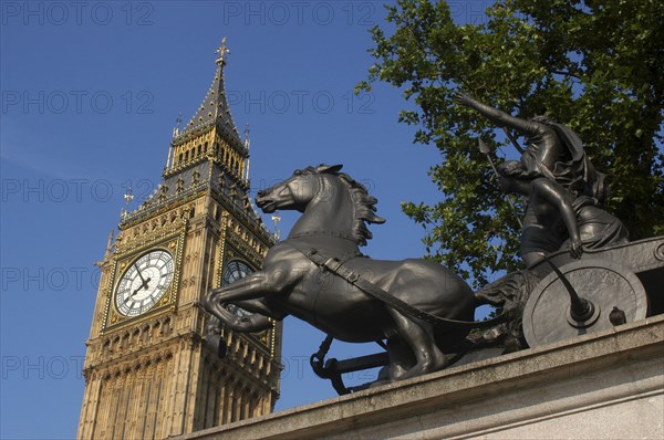 England, London, Westminster, Angled view looking up at Big Ben clock tower with the Boadicea statue in the foreground