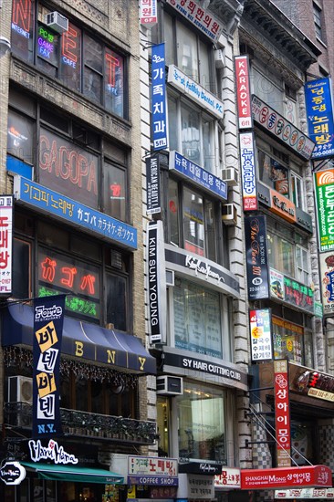 USA, New York, New York City, Manhattan  Korean signs for restaurants and shops on buildings in Little Korea on West 32nd Street in midtown.