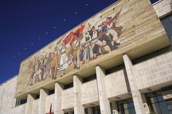 Albania, Tirane, Tirana, National History Museum. Mosaic on the exterior facade of the National History Museum in Skanderbeg Square representing the development of Albanias history.