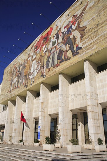 Albania, Tirane, Tirana, National History Museum. Mosaic on the exterior facade of the National History Museum in Skanderbeg Square with steps to entrance below.