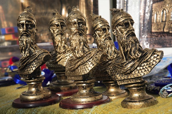 Albania, Kruja, Souvenirs displayed for sale on stalls in the market bazaar in the old town.