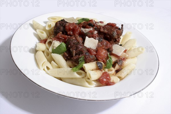 Food, Cooked, Pasta, Italian baked meat balls with black olives  basil and parmesan cheese served on penne.