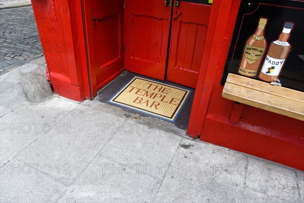 Ireland, County Dublin, Dublin City, Temple Bar traditional Irish public house entrance and pavement sidewalk.