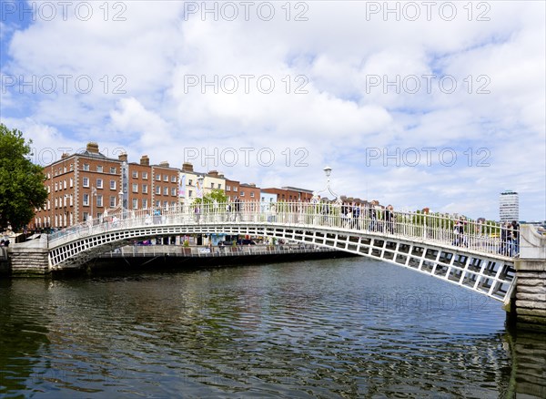 Ireland, County Dublin, Dublin City, The 1816 cast iron Ha Penny or Half Penny Bridge across the River Liffey.