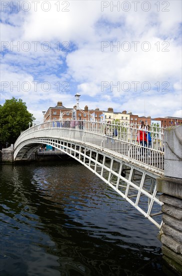 Ireland, County Dublin, Dublin City, The 1816 cast iron Ha Penny or Half Penny Bridge across the River Liffey.