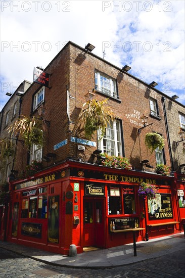 Ireland, County Dublin, Dublin City, Temple Bar traditional Irish public house on street corner with cobbled street.