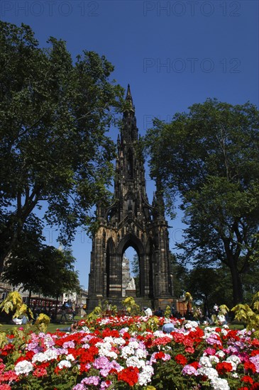 Scotland, Lothian, Edinburgh, Scott Monument in Princes Street with flower beds in the foreground
