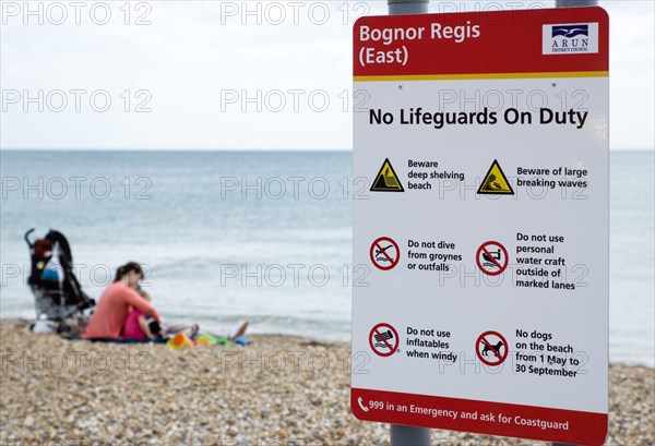 England, West Sussex, Bognor Regis, Sign on the beach warning that No Lifeguards ar On Duty and giving instruction on beach safety.