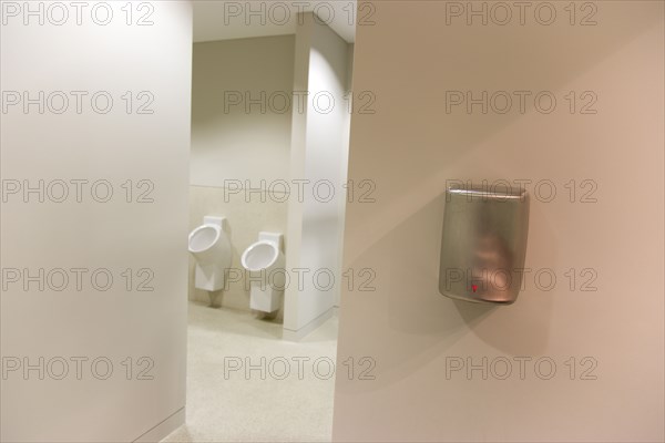 Ireland, County Dublin, Dublin City, Ballsbridge  Lansdowne Road  Aviva Stadium Male washroom with urinals and wall mounted hand dryer.