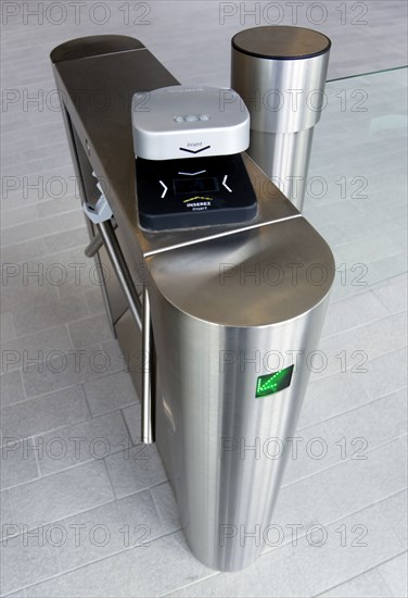 Ireland, County Dublin, Dublin City, Ballsbridge  Lansdowne Road  Aviva Stadium Stainless steel Turnstile with electronic card reader for reading tickets at entrance with green LED arrow pointing to the left.