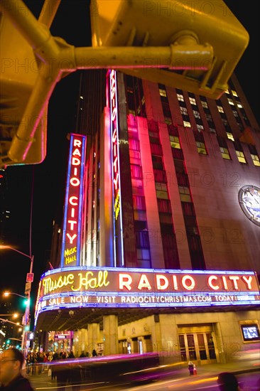 USA, New York, New York City, Manhattan  The Art Deco Radio City Music Hall on 6th Avenue and 50th Street illuminated at night.