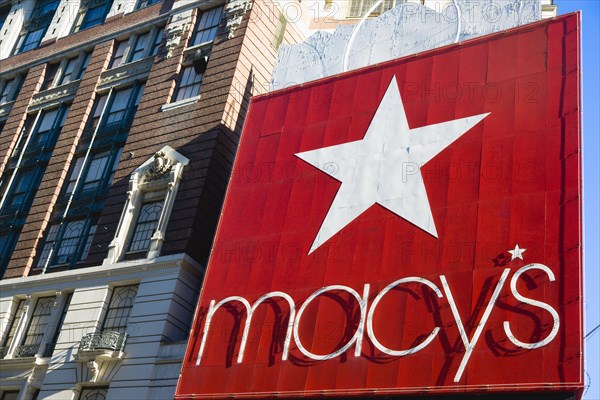 USA, New York, New York City, Manhattan  Red sign for Macys department store with cars on 34th Street and Broadway.