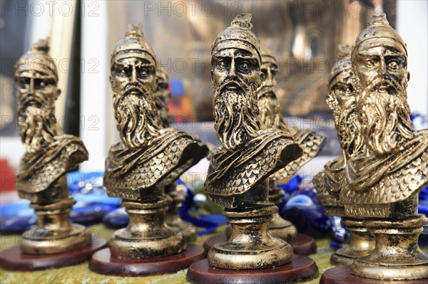 Albania, Kruja, Souvenirs displayed for sale on stalls in the market bazaar in the old town.