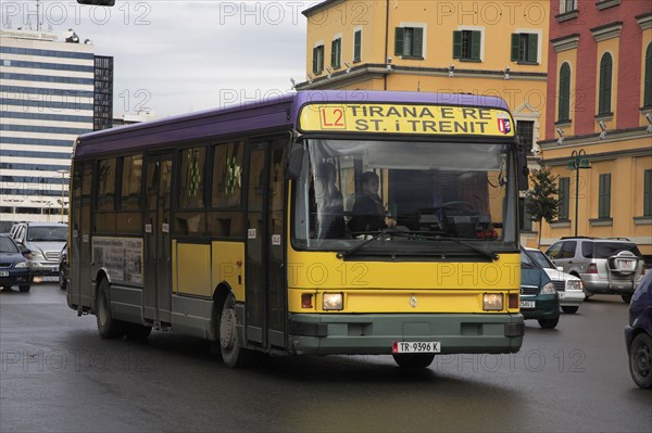 Albania, Tirane, Tirana, Public bus amongst other traffic.