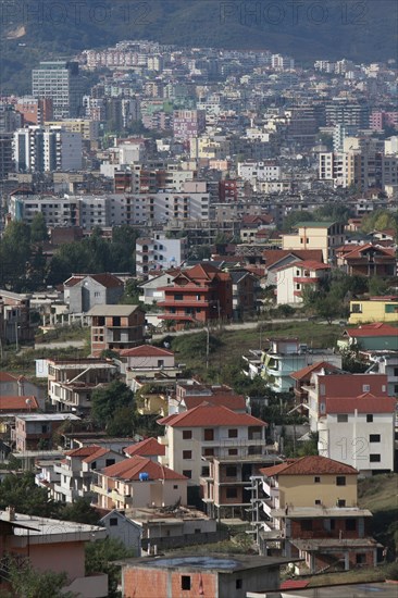 Albania, Tirane, Tirana, View across residential buildings to the hillside beyond.