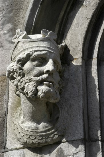 Ireland, Dublin, Crowned bearded face carved in stone on a building