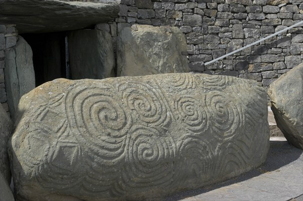 Ireland, Meath, Newgrange, Carved kerb stone outside the entrance to the historical burial site that dates from 3200BC