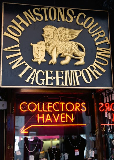 Ireland, County Dublin, Dublin City, Sign for Johnstons Court Vintage Emporium and red neon lights for Collectors Haven in the antiques market opposite Powerscourt Centre.