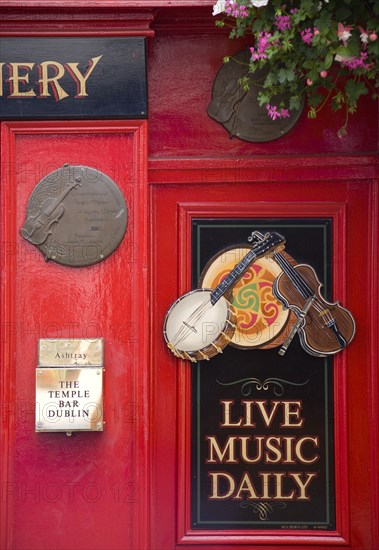 Ireland, County Dublin, Dublin City, Sign on Temple Bar traditioanl Irish pub advertising live music daily.