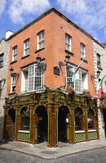 Ireland, County Dublin, Dublin City, The Quays public house on a street corner in Temple Bar with a cobbled road.