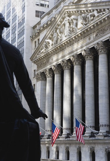 USA, New York, New York City, Manhattan  The New York Stock Exchange building in Broad Street beside Wall Street showing the main facade of the building featuring marble sculpture by John Quincy Adams Ward in the pediment called Integrity Protecting the W