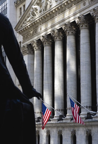 USA, New York, New York City, Manhattan  The New York Stock Exchange building in Broad Street beside Wall Street showing the main facade of the building featuring marble sculpture by John Quincy Adams Ward in the pediment called Integrity Protecting the W