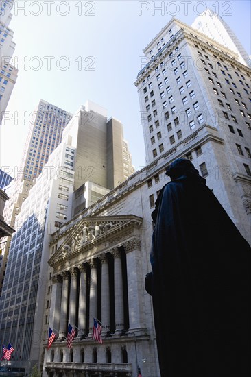 USA, New York, New York City, Manhattan  The New York Stock Exchange building in Broad Street beside Wall Street showing the main facade of the building featuring marble sculpture by John Quincy Adams Ward in the pediment called Integrity Protecting the W